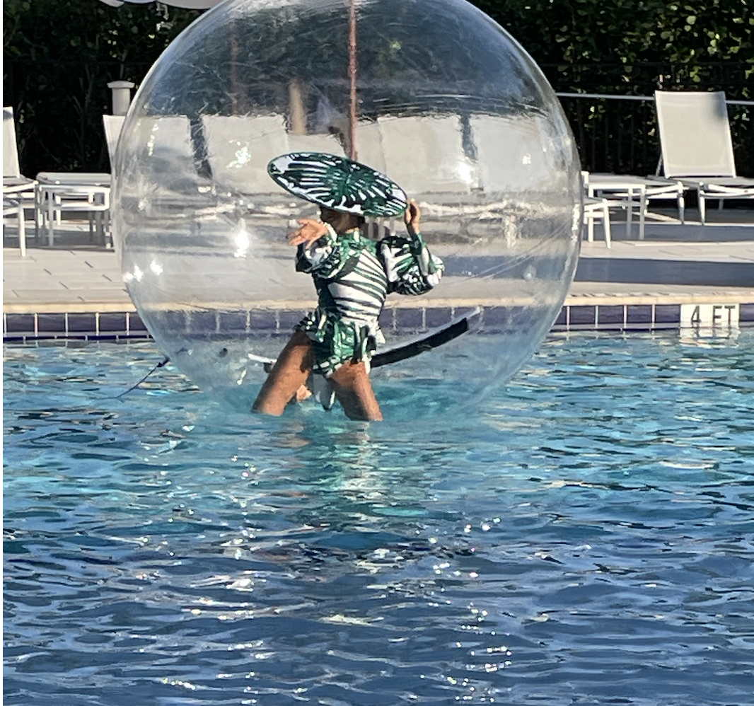 Woman in a ball in a pool